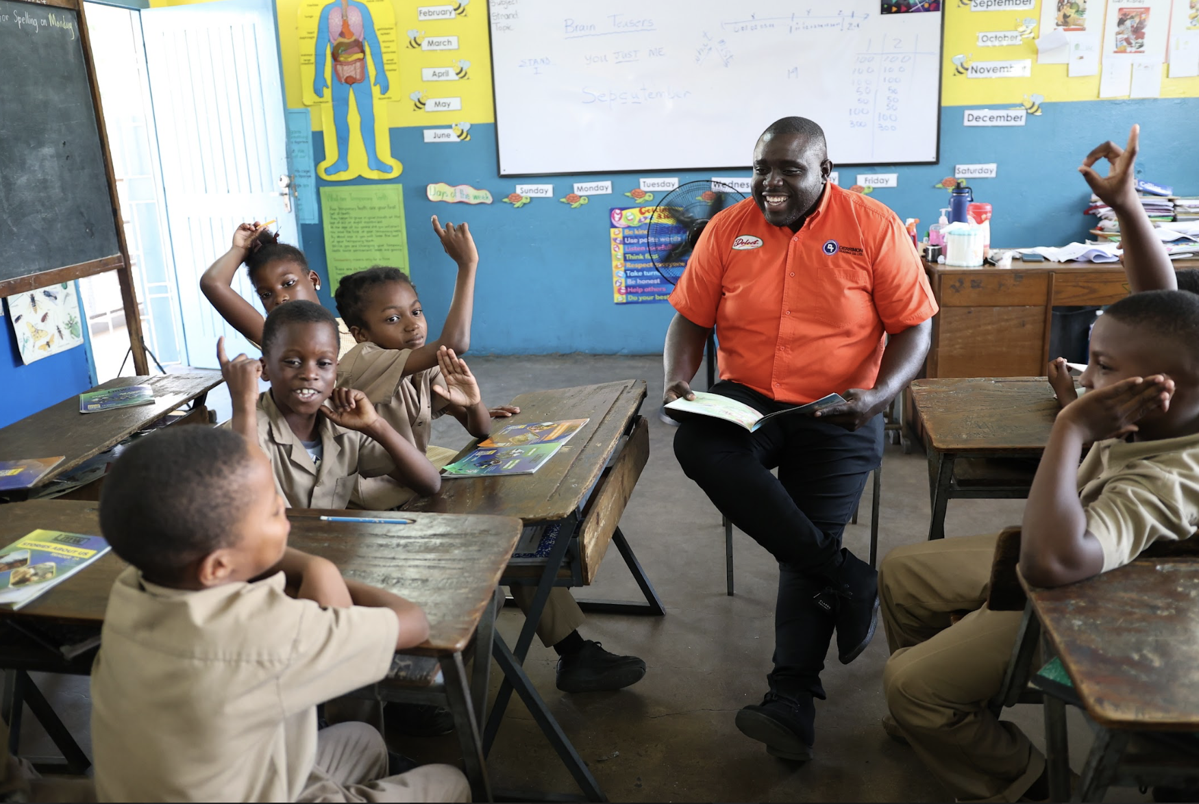 Warren Cornwall - Commercial Manager reads to students at Whitfield Primary